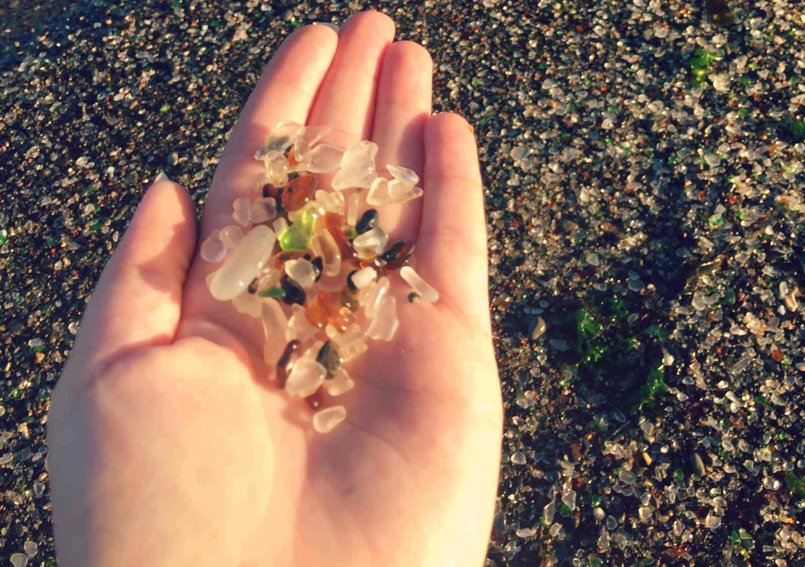 Sea glass on blogger Paula's hand at Fort Bragg Glass Beach in California