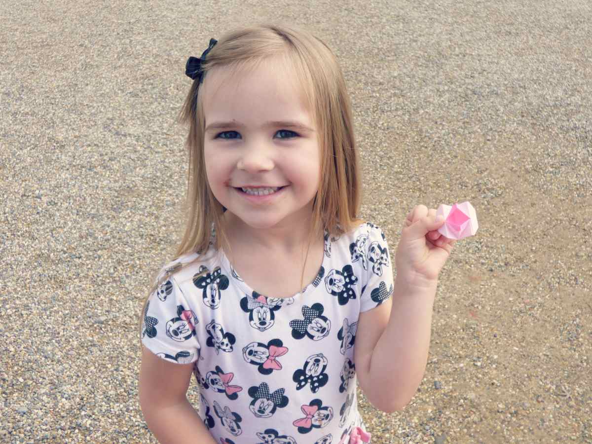 Our daughter with an origami she got in Japan