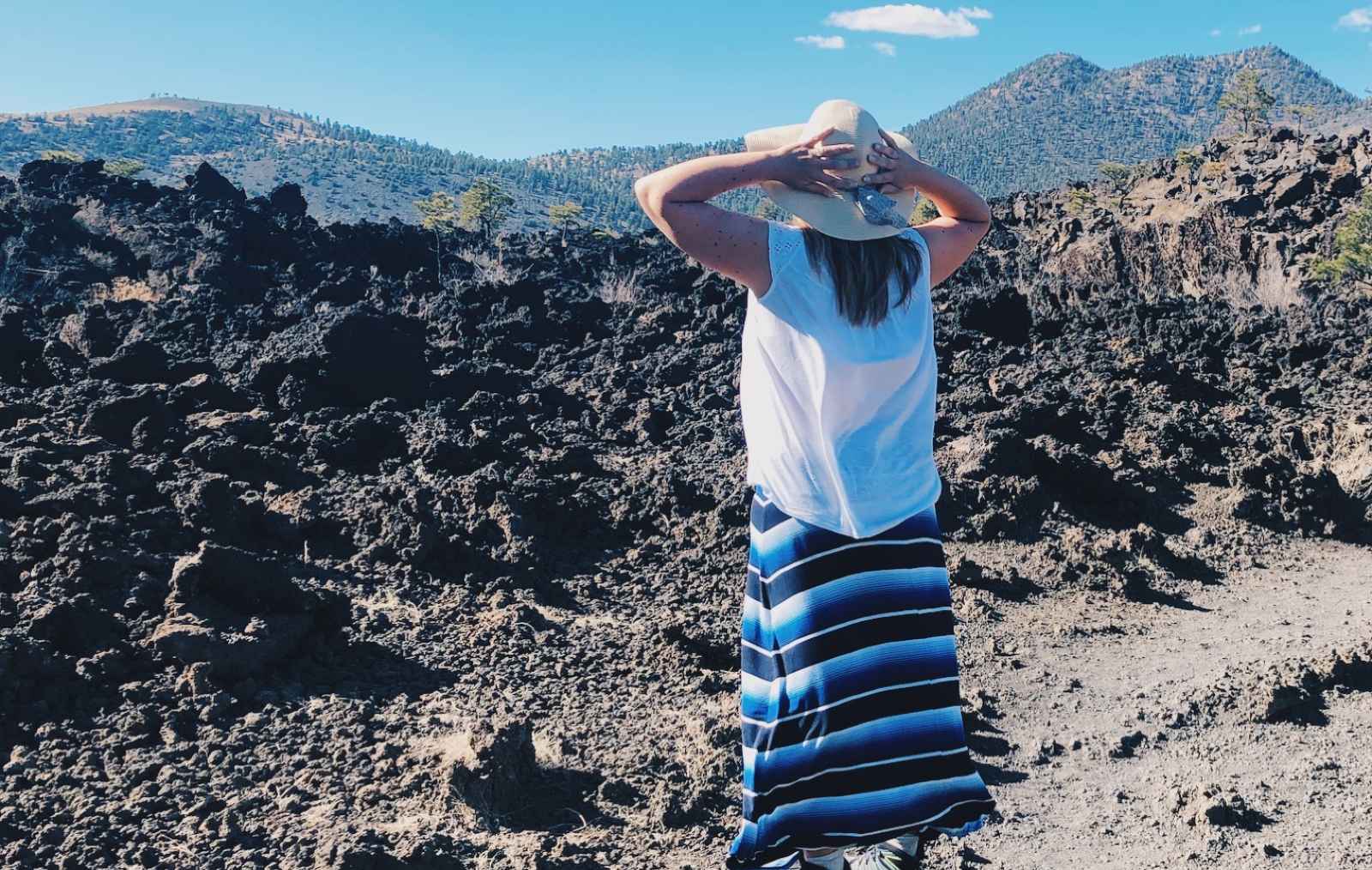 Blogger Paula looking at lava flow at Sunset Volcano National Monument in Arizona