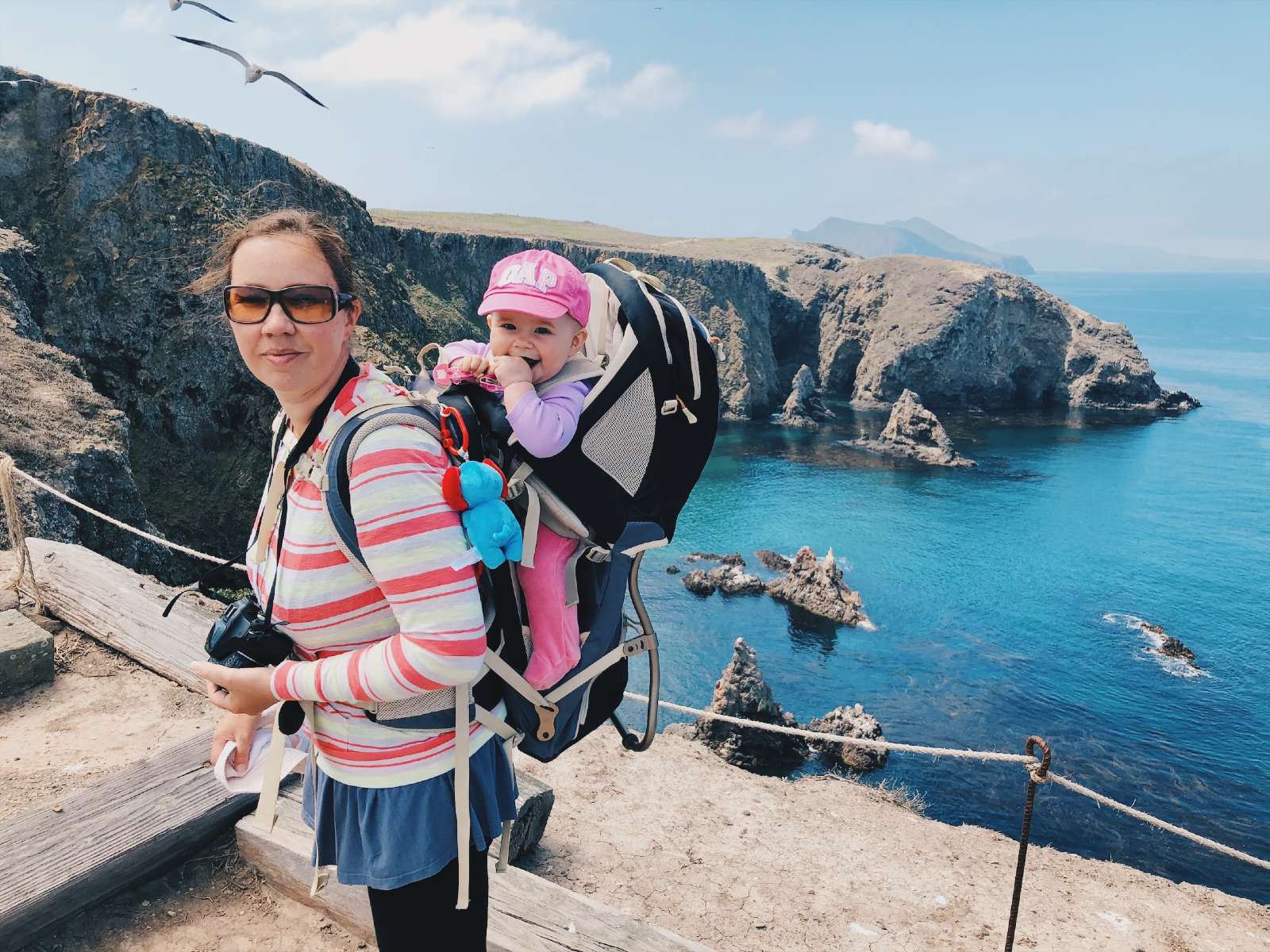 Blogger Paula hiking with a baby in a carrier at Channel Islands in California.