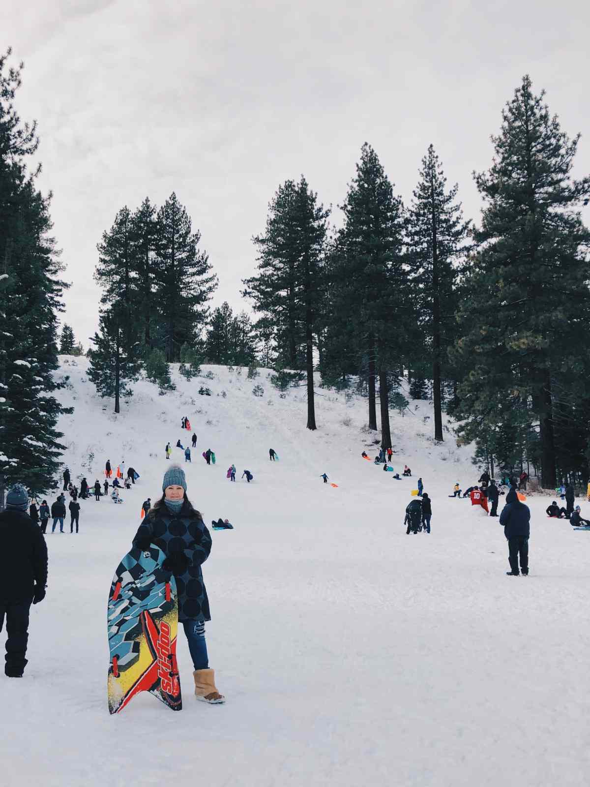 Blogger Paula in front of the sledding hill at Lake Tahoe.