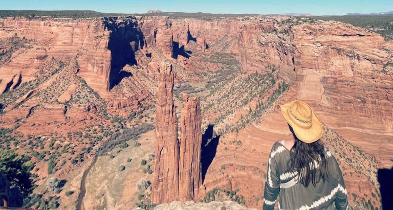Blogger Paula sitting by the Canyon de Chelly in Arizona