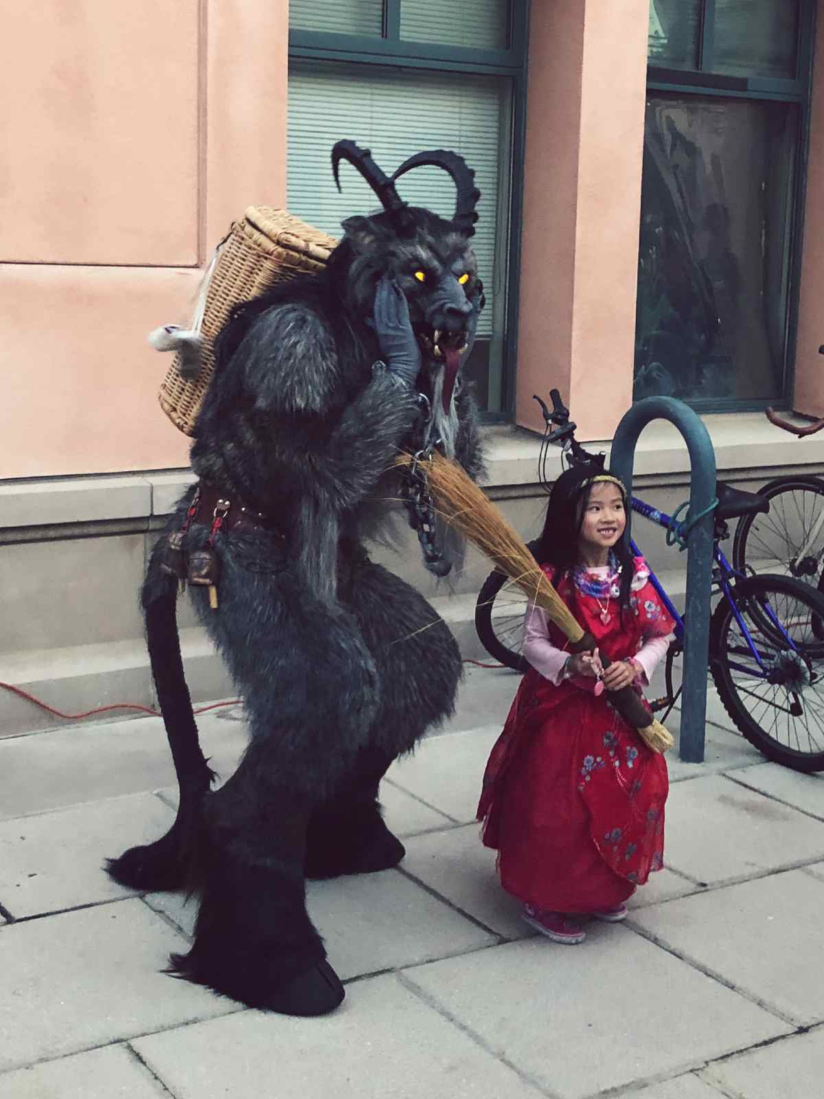 Krampus and a child at German Holiday Market in Mountain View, California