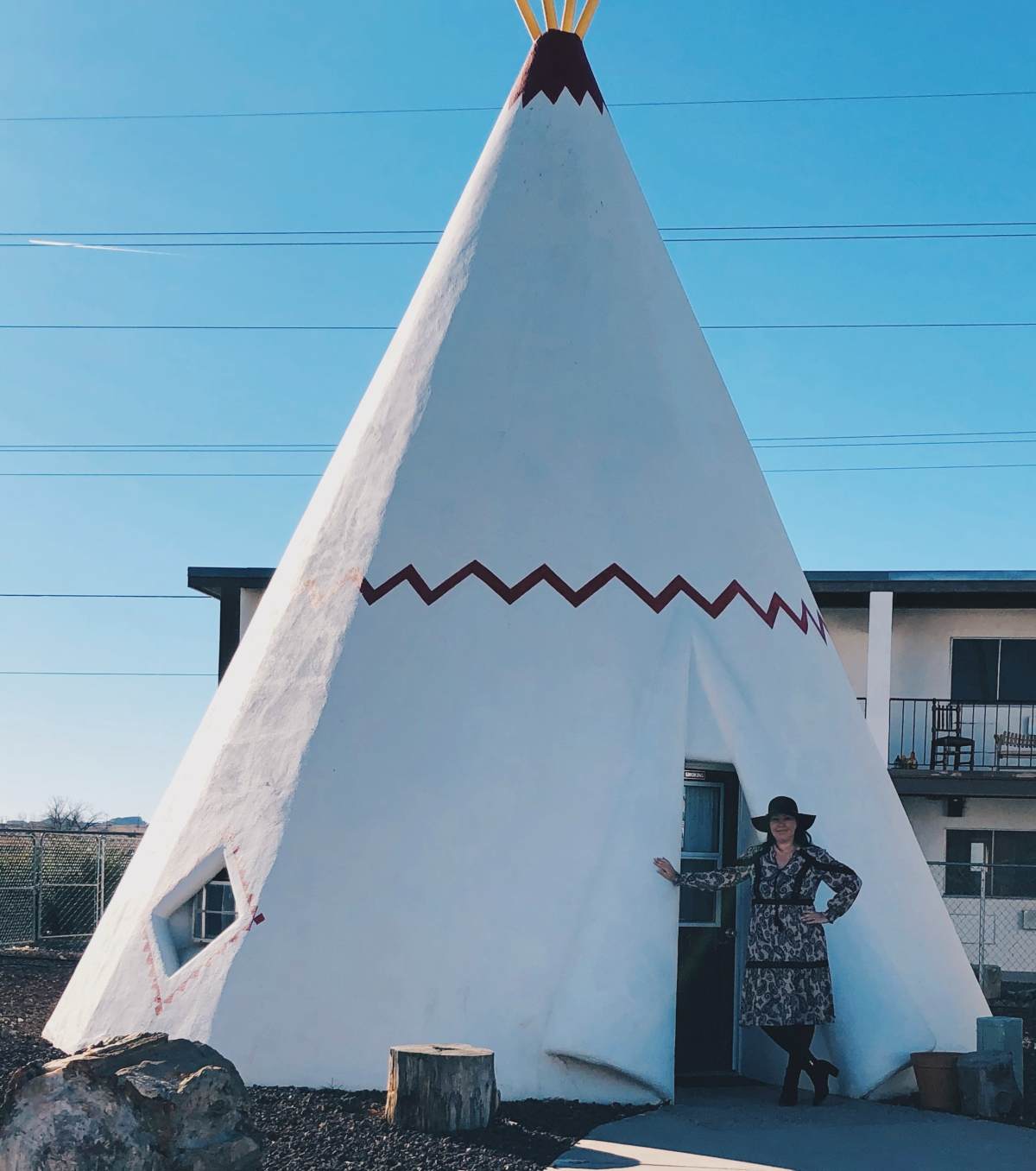 Blogger Paula in front of a Wigwam in Holbrook Arizona.
